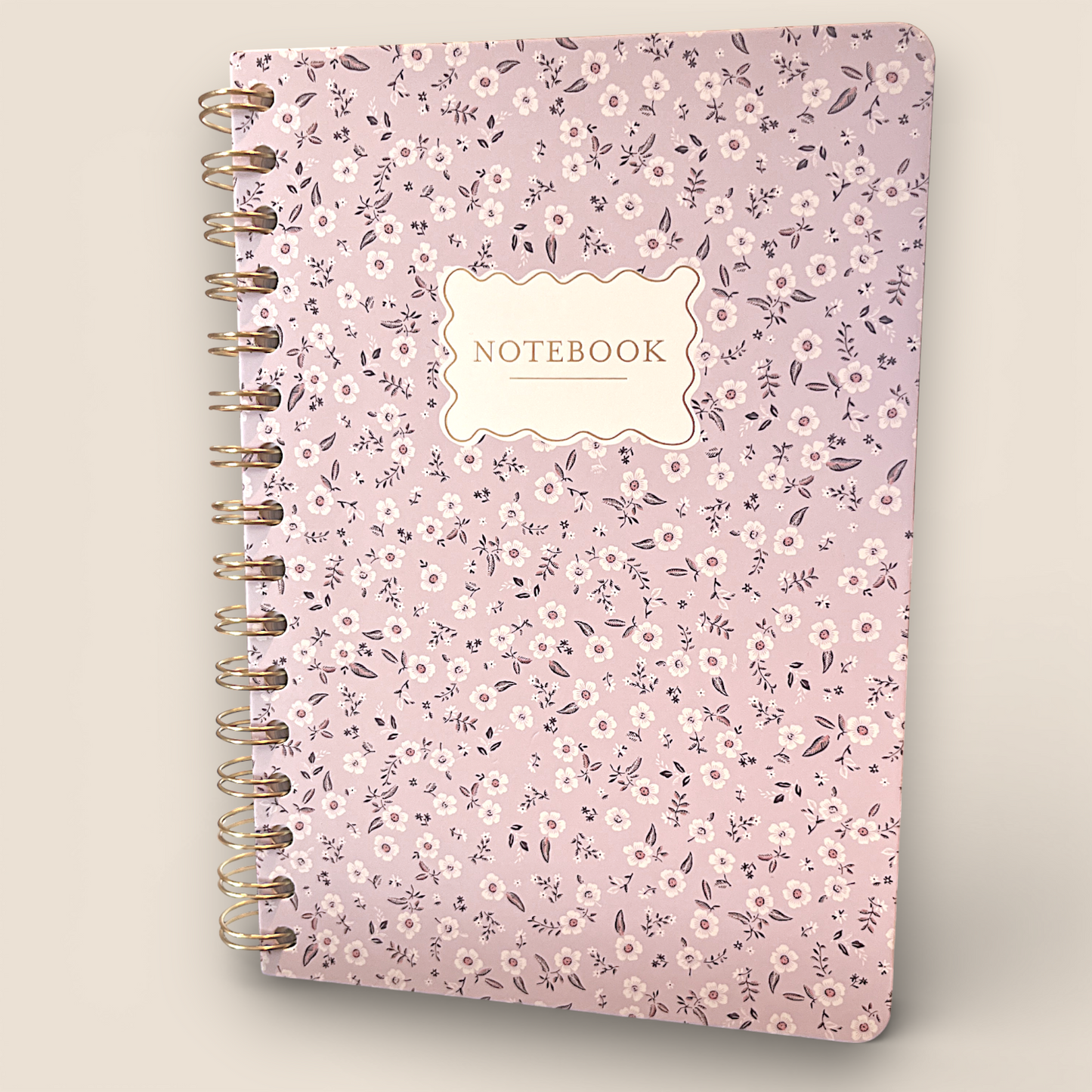 Carnet spiralé doré – Motif floral délicat